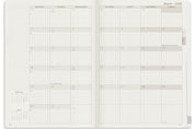 Wonderland 222 A5 planner open to a month overview page using wonderland 222 ultra thin ultra light weight paper