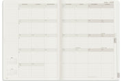 Wonderland 222 A5 planner open to a month overview page using wonderland 222 ultra thin ultra light weight paper