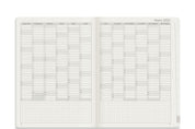 Wonderland 222 2026 B6 planner yearly overview spread featuring all 12 months in vertical columns with lined date rows and dot grid note section at the bottom, minimalist layout on white paper.