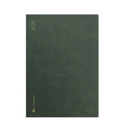 Wonderland 222 2026 A5 planner North Slope green textured cover with gold foil.