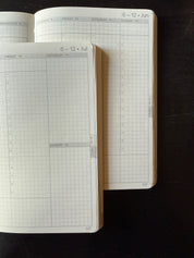 Wonderland 222 weekly planner layouts featuring minimalist grid pages, vertical weekly planning spreads, and fountain pen friendly Tomoe River paper designed for functional planning and hybrid bullet journaling.