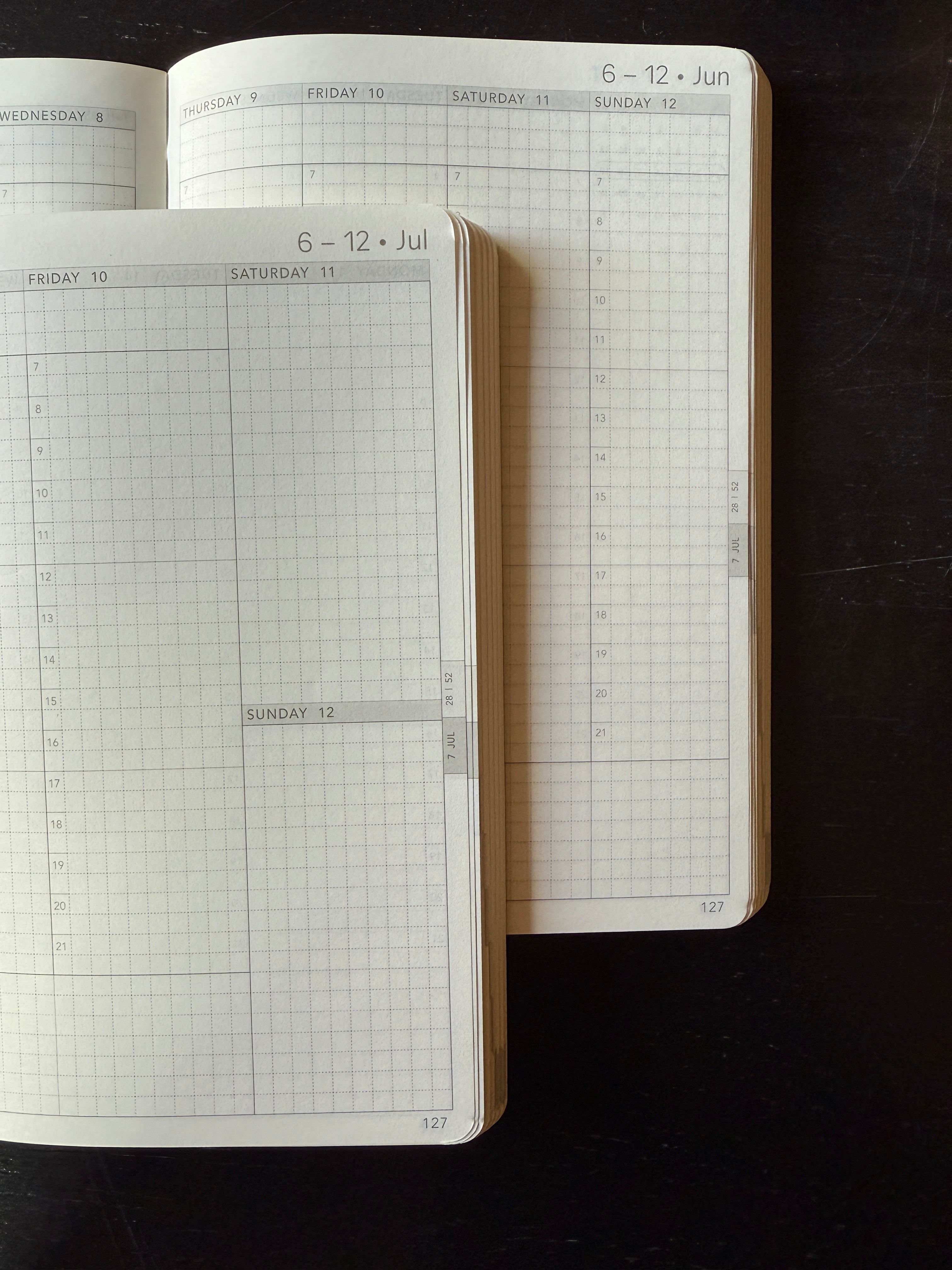Wonderland 222 weekly planner layouts featuring minimalist grid pages, vertical weekly planning spreads, and fountain pen friendly Tomoe River paper designed for functional planning and hybrid bullet journaling.