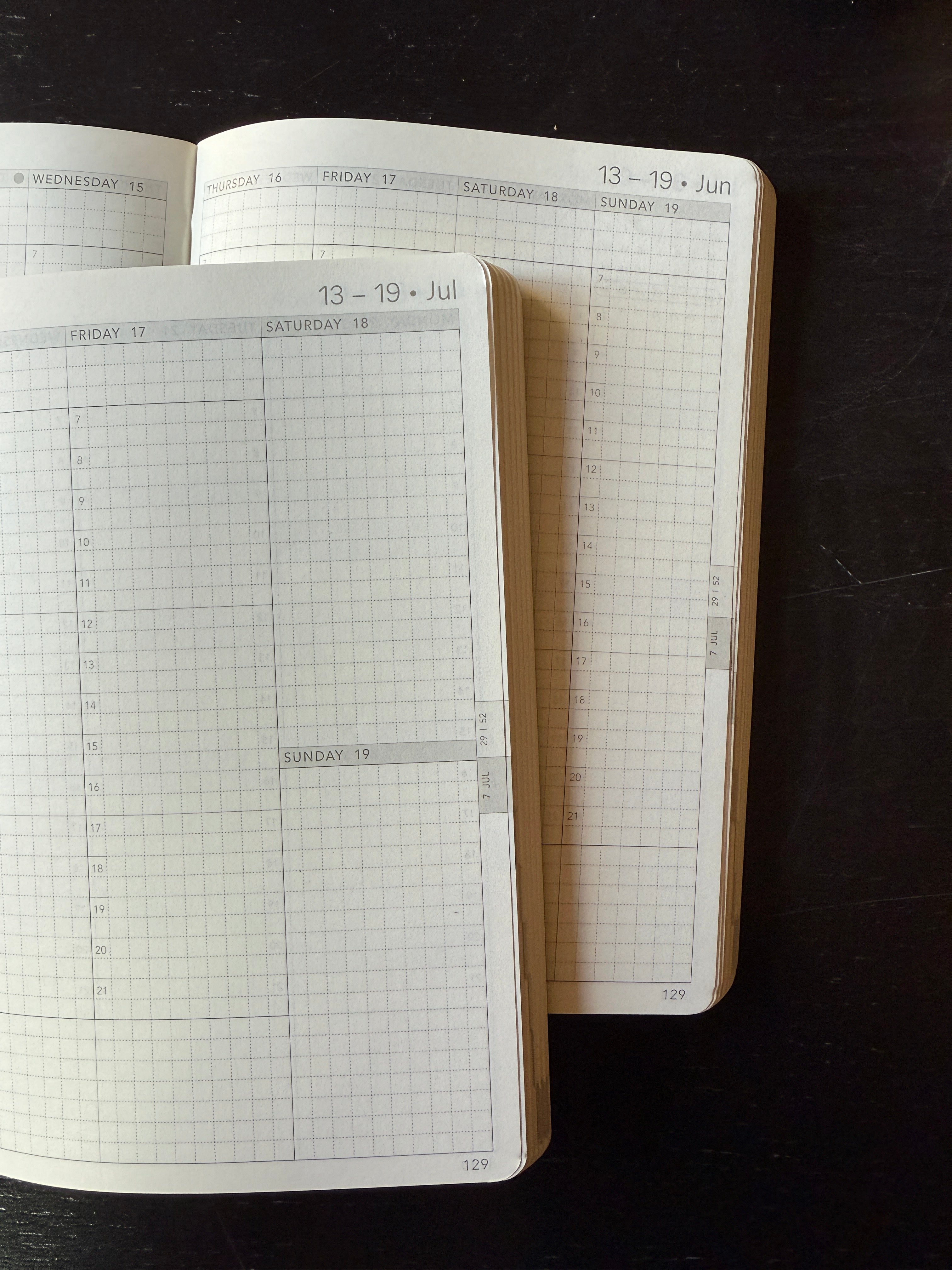 Wonderland 222 weekly planner layouts featuring minimalist grid pages, vertical weekly planning spreads, and fountain pen friendly Tomoe River paper designed for functional planning and hybrid bullet journaling.