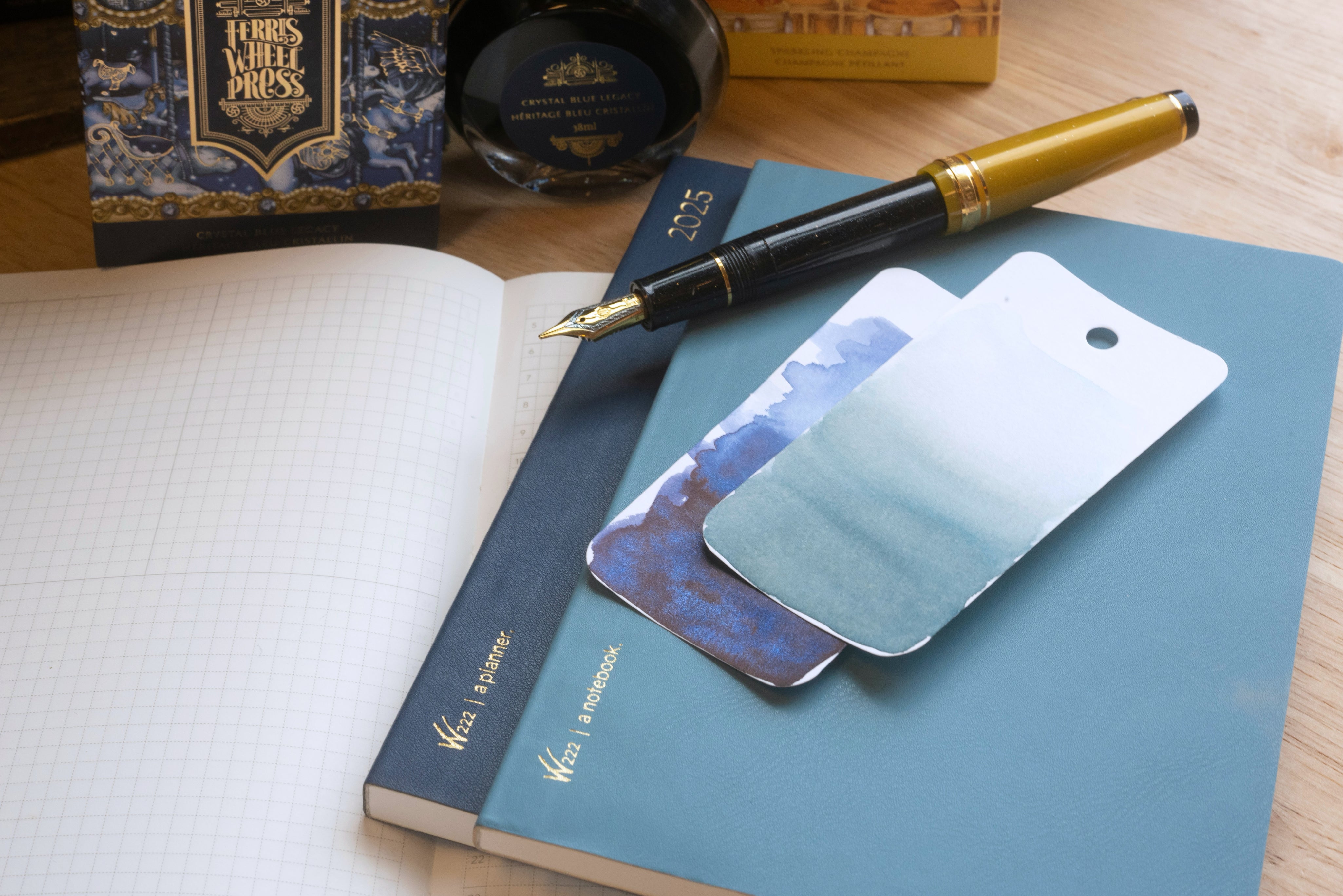 Wonderland 222 planner and notebook with fountain pen ink swatches, Ferris Wheel Press ink, and fountain pen friendly Tomoe River paper